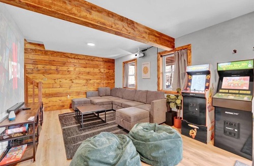 Gouldsboro Ski Chalet | FUN-FILLED A-Frame Chalet in the resort-like Big Bass Lake Community in the Poconos! ⊹ Movie Theater ⊹ Arcade Room ⊹ Hot Tub ⊹ Mini Golf ⊹ Indoor Fireplace ⊹ Outdoor Fire Pit