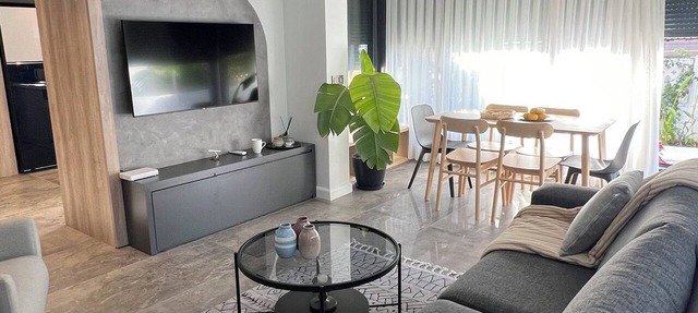 Charming Beachside Apartment with Private Garden in Side